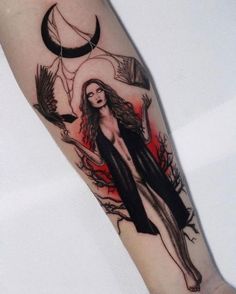 a person with a tattoo on their arm that has an image of a woman in the background