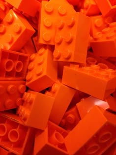 a pile of orange legos sitting on top of each other