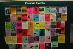 a bulletin board covered in many different colored papers