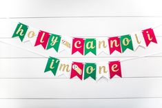 the banner is decorated with red, green and white pennants that read holly cannoli limoone