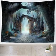 a wall hanging tapestry with an image of a forest scene in the middle of it