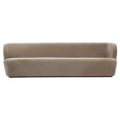 a beige couch sitting on top of a white floor