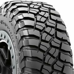 an all terrain tire on a white background