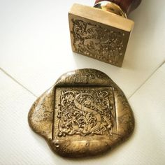 a rubber stamp with an ornate design on it