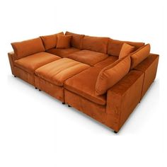 a large brown couch sitting on top of a white floor