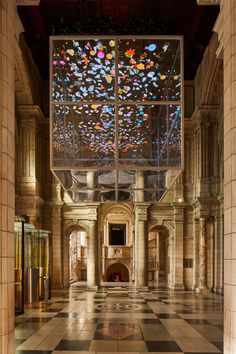 the ceiling is decorated with multicolored confetti and glass pieces that are suspended from the ceiling