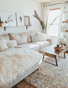 a living room filled with furniture and rugs on top of a white flooring