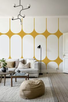 a living room with yellow and white walls