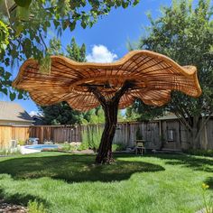 a large wooden structure sitting in the middle of a yard