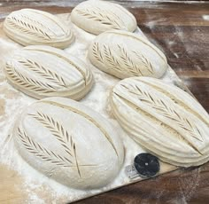 the bread is ready to be baked in the oven on the cutting board with flour