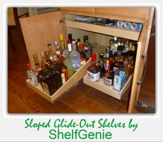 an open cabinet filled with bottles and liquor