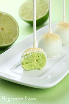 limes and marshmallow pops on a white plate