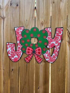 a wooden fence with a wreath and bow on it