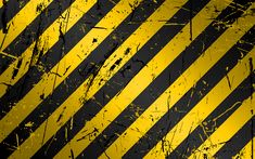 a yellow and black striped background that is very grungy