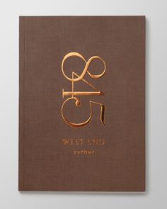 a brown book with gold lettering on it