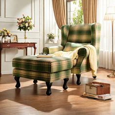 a chair and ottoman in a room with wooden floors