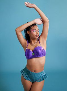 Life is better under the sea  but relaxing on the beach is pretty great too! Feel like the shiny mermaid you really are with this swim top from The Little Mermaid. Inspired by Ariel's shell bra  this swim top features a metallic  purple print with green clamshell detailing in the center. The padded  molded cups come with underwires for extra support and have scalloped edges. Comes with adjustable straps with faux pearl beads and a back strap. Pair with the matching bottoms to complete your Mermaid Purple Bra, Mermaid Tops Costume, Ariel Costume Plus Size, Mermaid Bra Top Yellow, Mermaid Swimwear For Beach Season, Beach Season Mermaid Swimwear, Mermaid Style Beachwear Swimwear, Mermaid Style Swimwear For Beach Season, Mermaid Swimwear For Beachwear