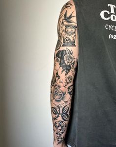 a man with tattoos on his arm and shoulder