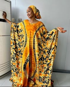 🎈This Adire silk Kaftan dress is made of high quality adire silk (Nigerian tie dye) that feels good on the skin. Look simple, yet sophisticated enough to steal all the attention. Great African Summer Boubou outfit. 🎈Details  - Custom made from scratch  -Loose Fit :  You can provide your measurements / I'll make according to the measurements of the size you choose  - Neckline: Off Shoulder  -Dress Length 58 inches ( It can be made shorter if you want or according to your height) -100% West Afri Tie Dye African Outfits, Flowy African Dress, African House Dress, Tie And Dye Bubu Gown Styles, African Mumu Dress, African Auntie Dress, Yellow Silk Floor-length Maxi Dress, Yellow Silk Maxi Dress Floor-length, Bohemian Silk Floor-length Gown