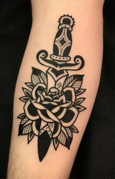 a black and white tattoo design on the arm