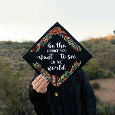 a person wearing a graduation cap that says be the change you want to see in the world