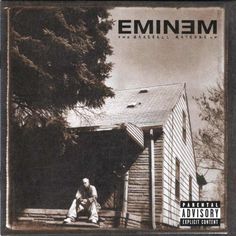 an album cover with a man sitting in front of a house