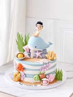 Customised Cakes • Creme Maison Bakery Singapore Sea Theme Cake, Whale Birthday Cake, Baby Shower Cupcake Cake, Lolly Cake, Customised Cakes, Elephant Baby Shower Cake, Panda Items, Whale Birthday, Dummy Cake