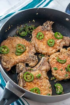 steak and pepper pork chops in a skillet