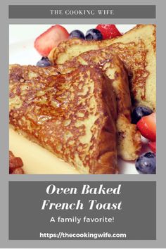 two pieces of french toast on a plate with berries and strawberries next to it