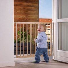 a little boy standing in front of a door with the words kids design uk free uk delivery