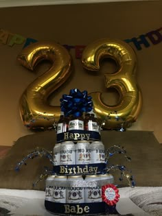 a birthday cake made out of beer cans