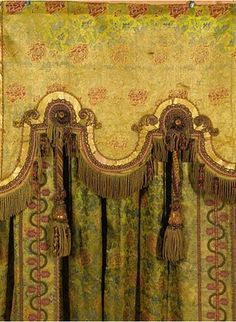 an ornate curtain with fringes and tassels