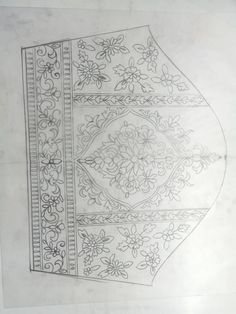 a drawing of an ornate design on paper