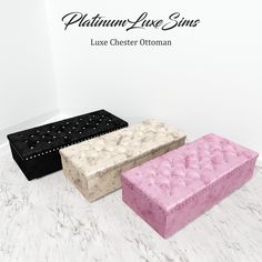 three different colored ottomans sitting on top of a white floor