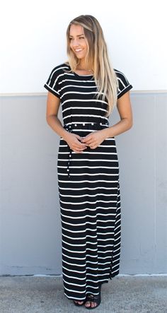 Looking for the perfect dress to transition from summer to fall? Look no further than our Cuffed Sleeve Striped Maxi Dress! This stunning dress features cuffed sleeves and a waist tie that add just the right amount of detail to make it stand out from the crowd. Available in Small, Medium, Large, and XLarge sizes, this dress is sure to flatter any figure. Our model, standing at 5'6", is wearing a size small, but with the adjustable waist tie, you can customize the fit to your liking. Plus, with a Casual Striped Maxi Dress For Work, Spring Black Maxi Dress With Tie Waist, Casual Spring Dress With Banded Waist, Casual Spring Dresses With Banded Waist, Casual Dress With Banded Waist For Spring, Black Belted Maxi Dress For Summer, Black Maxi Dress With Tie Waist For Work, Casual Maxi Dress With Tie Waist For Work, Black Midi Dress With Tie Waist For Summer