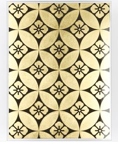 an intricate gold and black tile design