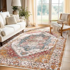 a living room filled with furniture and a large rug