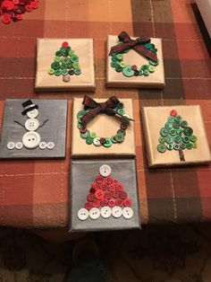 four pieces of fabric with buttons and bows on them, sitting on a table top