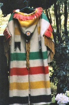 a colorful coat hanging on a clothes rack