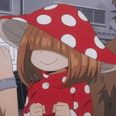 two anime characters wearing red and white polka dot hats, one is holding her hand up to the other