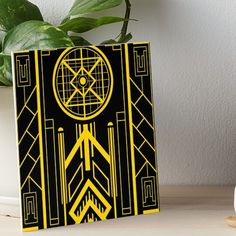 a black and yellow art deco design with geometric shapes