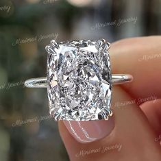 Handmade 12.5 CT Elongated Cushion Cut Moissanite Engagement Ring,Celebrity Style big large moissanite Solitaire with Hidden Halo and Double Prong unique Luxury Wedding Ring" → Occasions: Engagement & Wedding DESCRIPTION  -------------------- STYLE                :Solitaire / Hidden halo / Double prong ●𝐂𝐞𝐧𝐭𝐞𝐫 𝐒𝐭𝐨𝐧𝐞 𝐃𝐞𝐭𝐚𝐢𝐥𝐬 →Stone Type      :Moissanite - High Quality →Main Stone      :Cushion →Size (mm)        :14*11 →Carat Weight   :12.5  ●𝐌𝐚𝐢𝐧 𝐬𝐭𝐨𝐧𝐞 𝐨𝐩𝐭𝐢𝐨𝐧 𝐢𝐧 Cushion Wedding Ring, Big Diamond Ring, Big Diamond Rings, Cushion Cut Moissanite Engagement Ring, Moissanite Engagement Ring Cushion Cut, Pear Moissanite Engagement Ring, Luxury Wedding Rings, Elongated Cushion Cut, Plus Size Rings