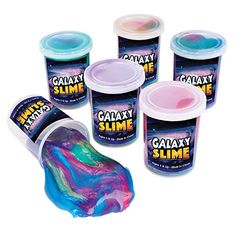 six different colors of galaxy slime in buckets and one is pink, purple, blue