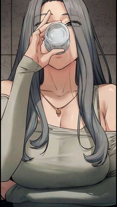 a woman with long gray hair drinking from a cup