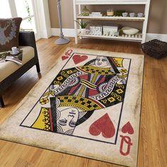 a rug with playing cards on it in a living room