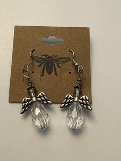 Handmade Guardian Angel Earrings with clear crystal-like beads and silver wings and halo. Drop length is 2". Wings And Halo, Drop Earrings Silver, Angel Earrings, Silver Wings, Earring Ideas, Christmas Earrings, Silver Drop Earrings, Guardian Angel, Earrings Silver