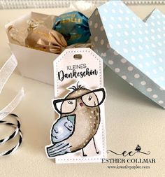 a gift box with an owl and bird tag