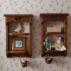 two wooden shelves with pictures and figurines on them