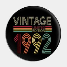 a badge with the words vintage limited in rainbows and black, on a white background