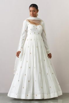 White full length anarkali with all-over floral motif hand embroidery. Comes with net embroidered border dupatta. Components: 2 Pattern: Hand Embroidered Type Of Work: Leaf Motifs Neckline: Sweetheart Sleeve Type: Churi Sleeves Fabric: Modal Cotton, Net Color: White Other Details:  Attached lining Back plunged neck with tie-up Embroidered border dupatta Approx. product weight (in kgs): 2 Occasion: Wedding - Aza Fashions Anarkali Dress Simple, Churi Sleeves, Floral Anarkali, Anarkali With Dupatta, White Frock, Embroidered Leaf